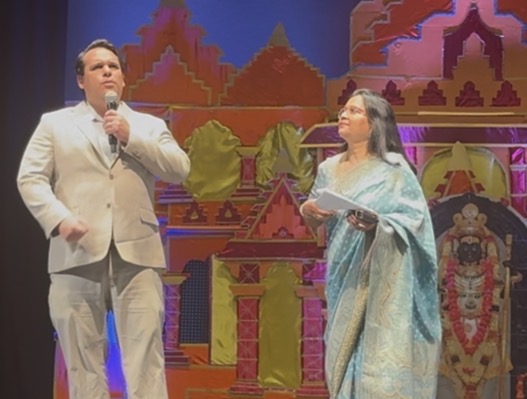 Justin Martinez speaking at a community cultural event